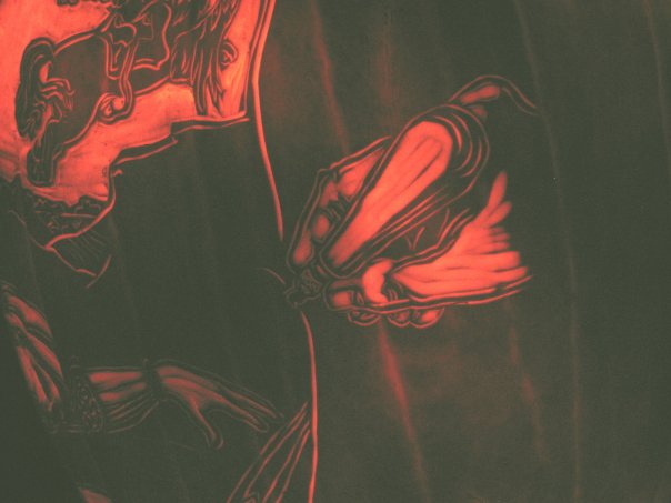 The tool used to carve the pumpkin -- a 'linozip' gouge designed for linoleum block prints, is shown in action on the far right